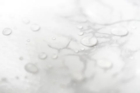 Water drops on marble surface 스톡 사진