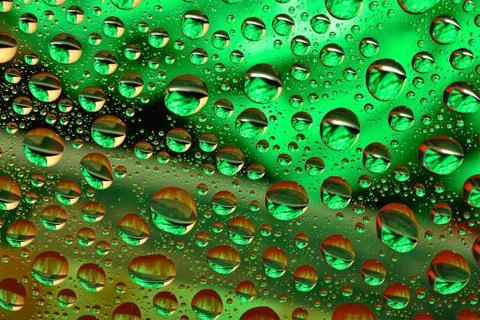 Water drops on multicolor background Stock Photos