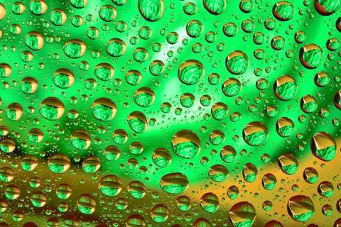 Water drops on multicolor background Stock Photos