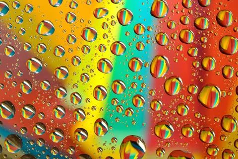 Water drops on multicolor background Stock Photos