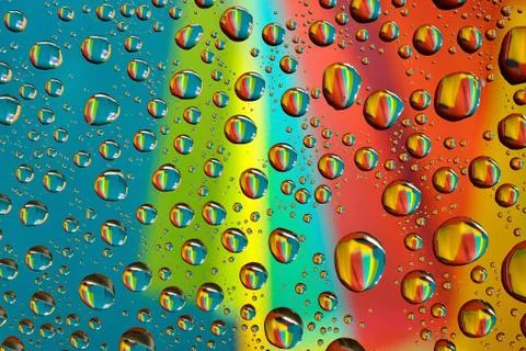 Water drops on multicolor background Stock Photos