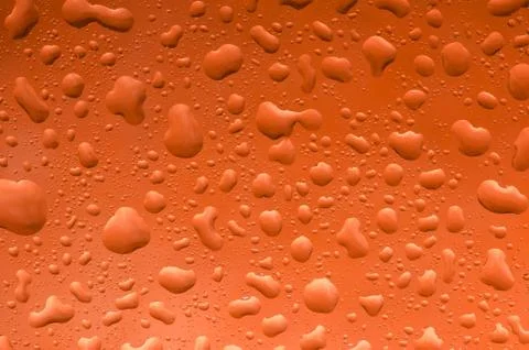 Water drops on nice onrange background pattern. Fotos de archivo
