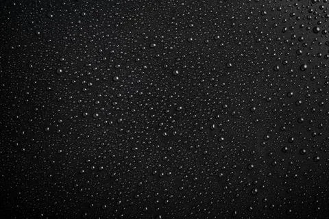 Water drops pattern on black background Foto stock