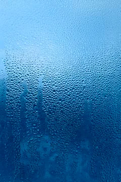Water drops pattern on glass Stock Photos