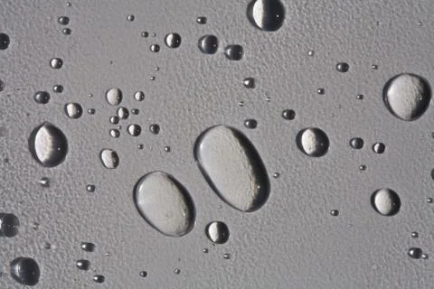 Water drops on a plane surface Stock Photos