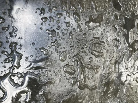 Water drops from the rain on the gray surface of the table 写真素材