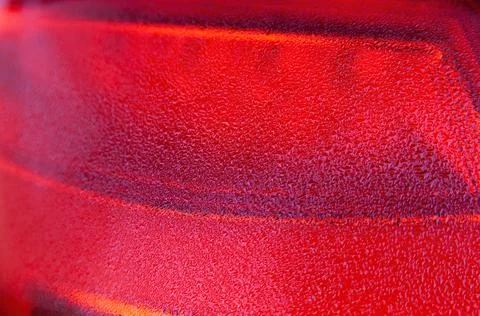 Water drops on red background Stock Photos