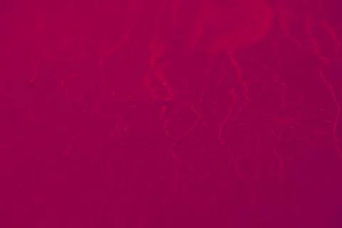 Water drops on red background texture Stock Photos