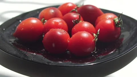 Water drops on red cherry tomatoes Stock Footage 133344596