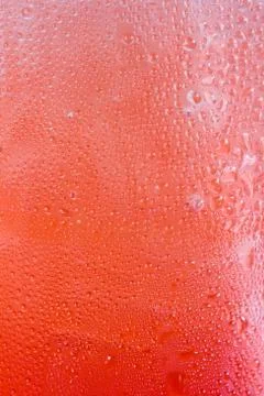 Water drops on red Stock Photos