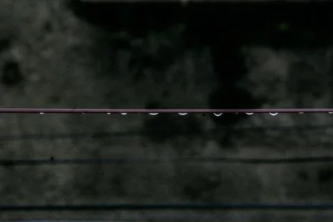 Water Drops on Roof Wire Stock Photos