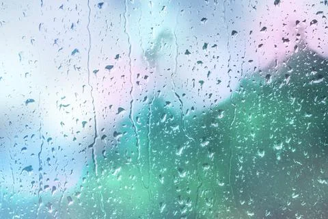 Water drops run down glass window. Abstract blurred background with lights bokeh Stock Illustration