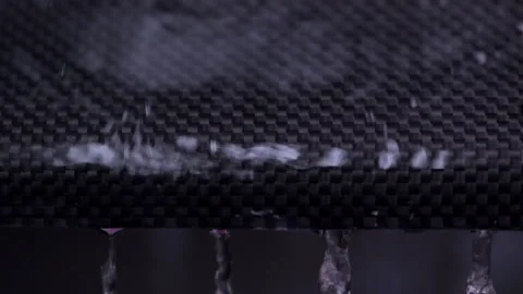 Water Drops Running Down Carbon Fiber Stock Footage 154823932