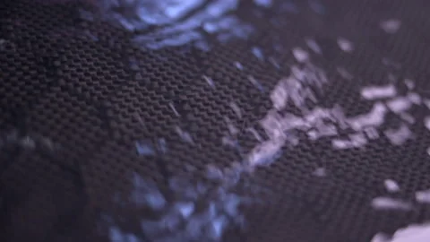 Water Drops Running Down Carbon Fiber Stock Footage 154824039