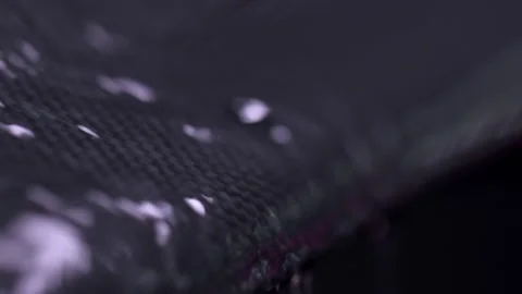 Water Drops Running Down Carbon Fiber Stock Footage 154824323