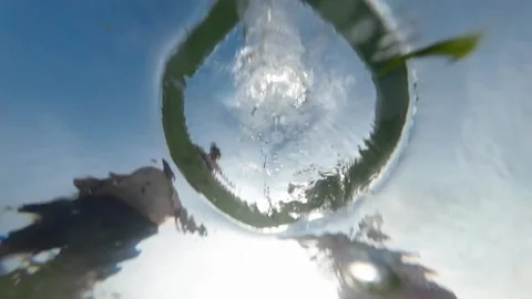 Water drops seen from below 스톡 동영상 284990306