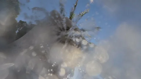 Water drops shower down from a stone fountain, capturing a refreshing moment Stock Footage 339821761