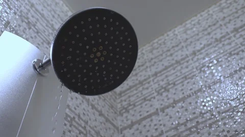 Water drops in the shower head. Shower turning off . 4k video. 23.98 fps Stock Footage 120295012