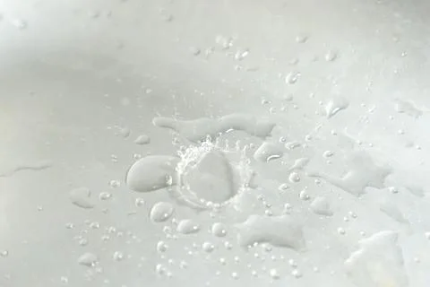 Water Drops on a Silver Background Stock Photos