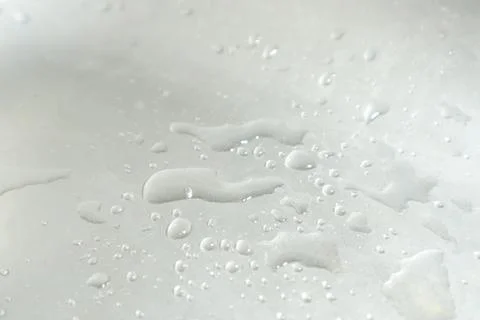 Water Drops on a Silver Background Stock-Fotos