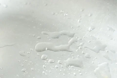 Water Drops on a Silver Background Stock Photos