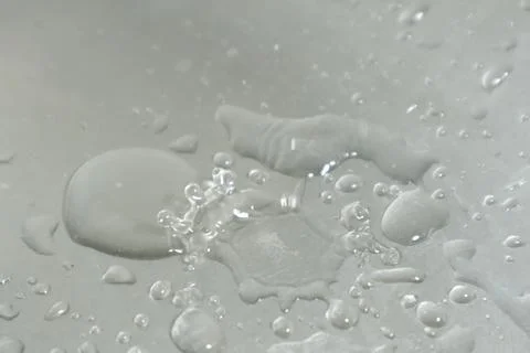 Water Drops on a Silver Background Stock Photos