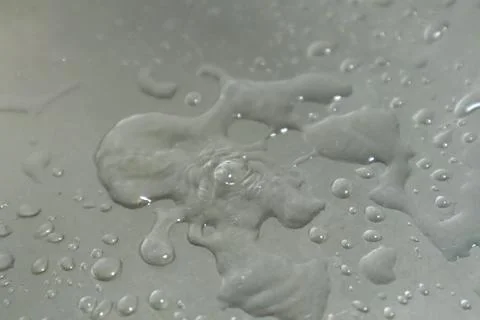 Water Drops on a Silver Background Stock Photos
