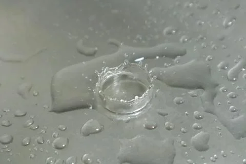 Water Drops on a Silver Background Stock Photos