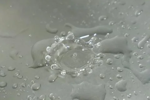 Water Drops on a Silver Background Stock-Fotos