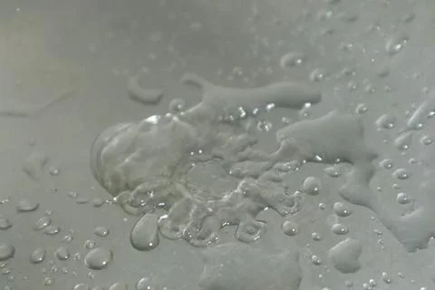Water Drops on a Silver Background Foto stock