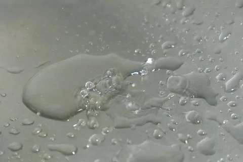 Water Drops on a Silver Background Stock Photos