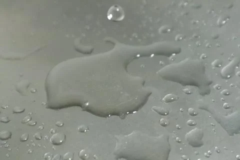 Water Drops on a Silver Background Stock Photos