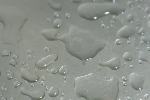 Water Drops on a Silver Background Foto stock