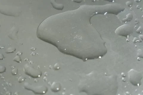 Water Drops on a Silver Background Stock Photos