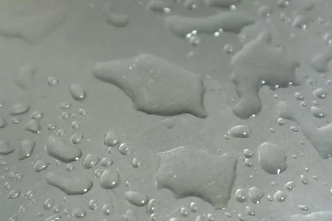 Water Drops on a Silver Background Stock Photos