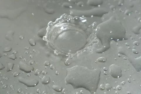 Water Drops on a Silver Background Stock Photos