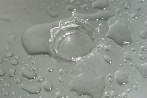 Water Drops on a Silver Background Stock Photos