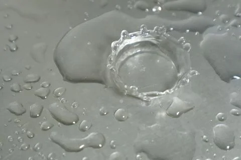 Water Drops on a Silver Background Stock Photos