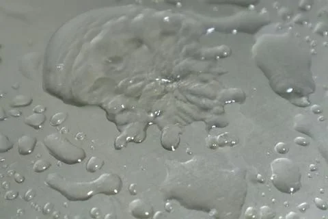 Water Drops on a Silver Background Stock Photos