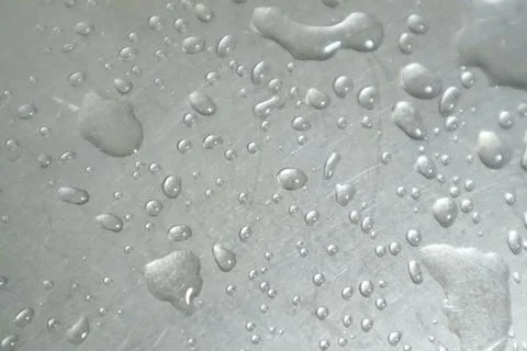 Water Drops on a Silver Background Stock Photos