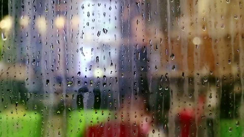 Water drops sliding down on store window glass Stock Footage 70555252