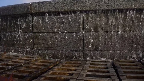 Water drops splashing on water surface in slow motion. Water fountain Stock Footage 118466125