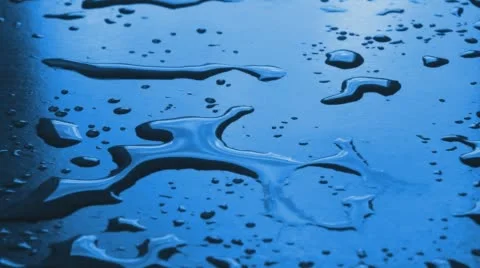 Water drops on surface Stock Footage 59869960