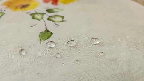 Water drops on a tablecloth Stock Photos