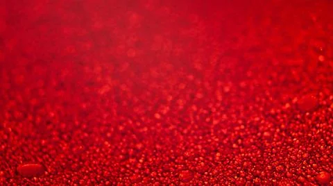 Water drops texture on red background . Stock Photos
