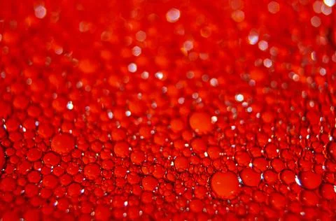 Water drops texture on red background . Stock Photos