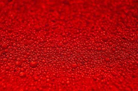 Water drops texture on red background . Stock Photos