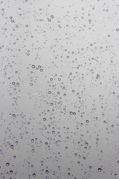 Water drops texture. reflection of rain in a window in autumn Stock Photos