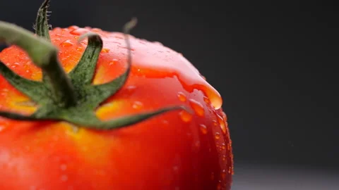 Water drops on tomato in slow motion Stock Footage 133975465