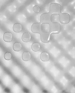 Water drops on a wavy plastic surface Stockfoto's